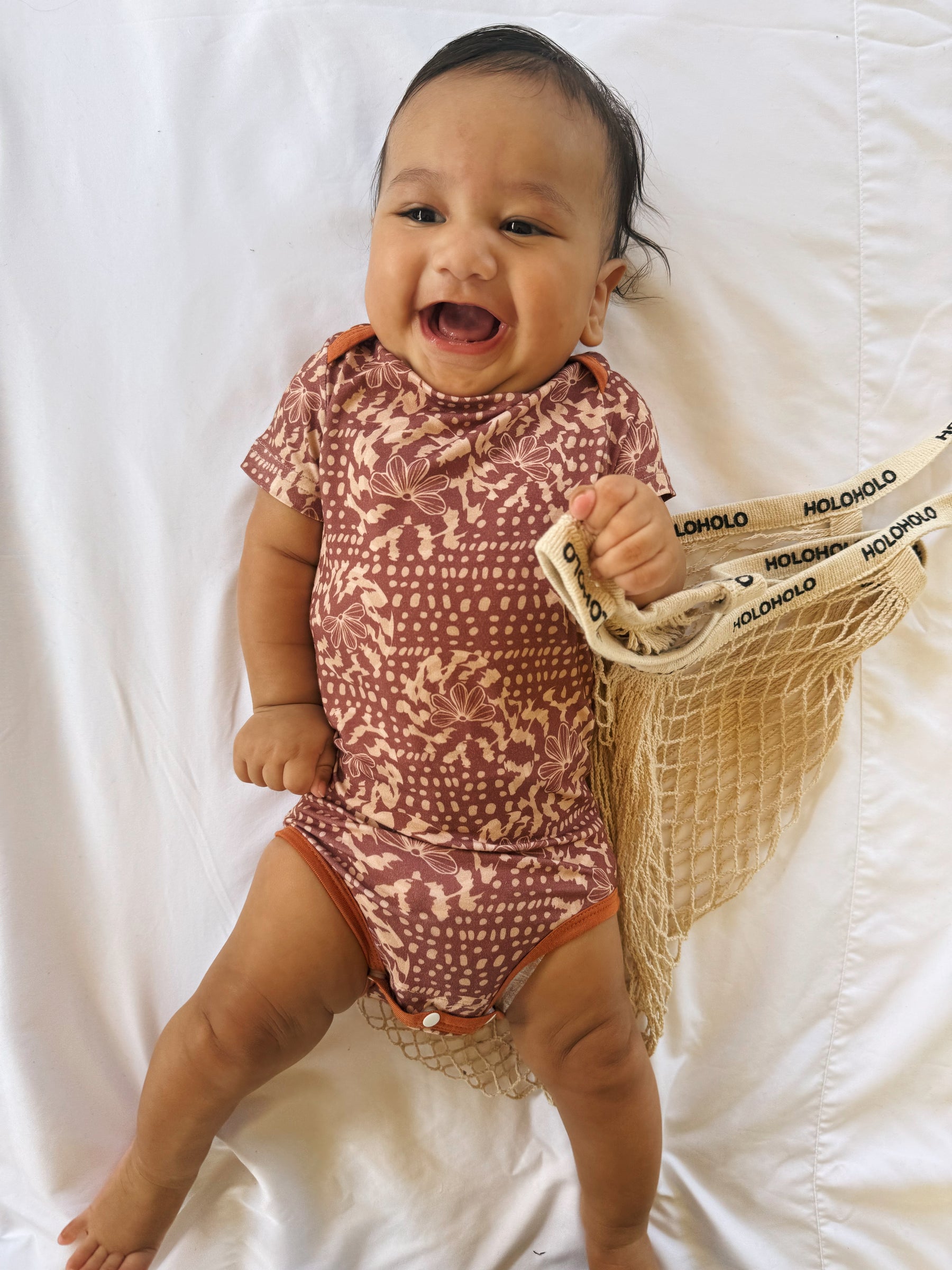 Naupaka shell onesie