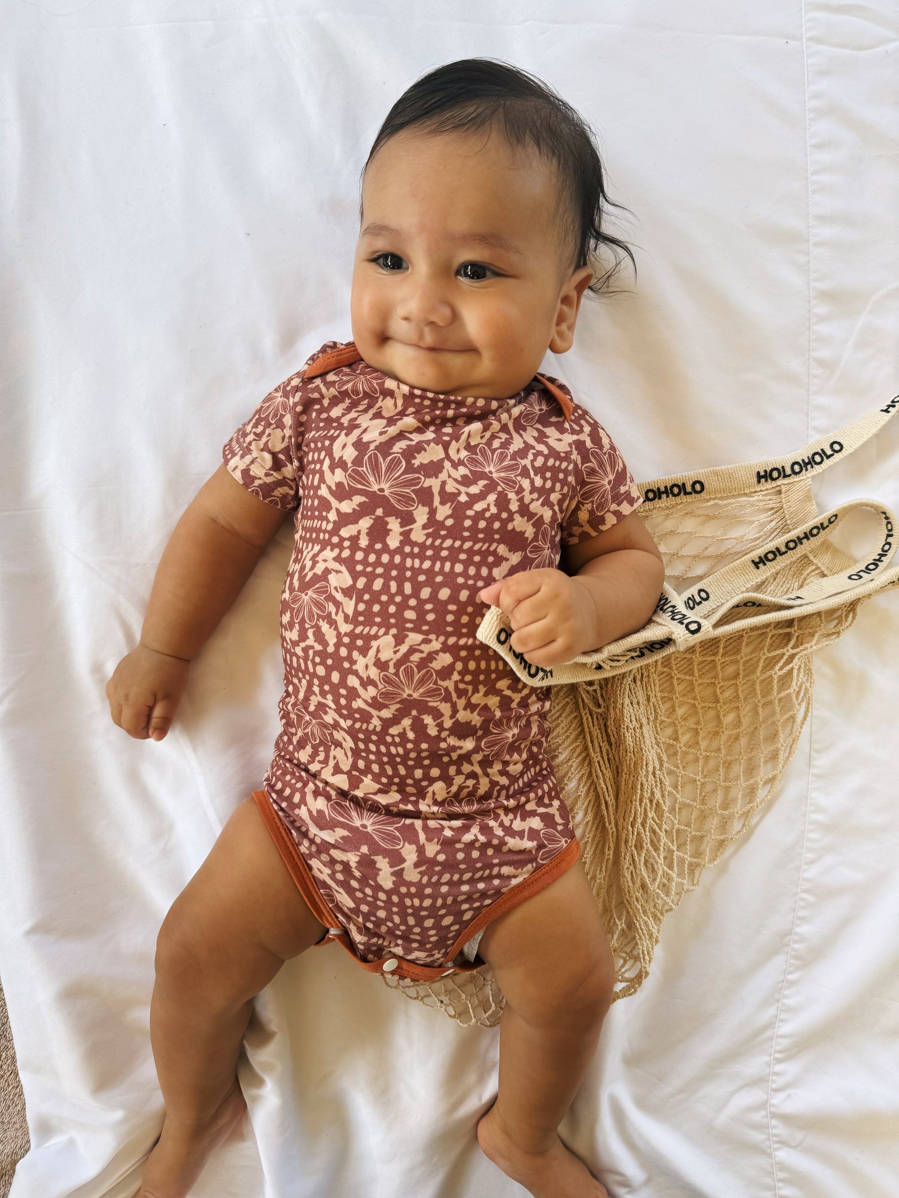 Naupaka shell onesie