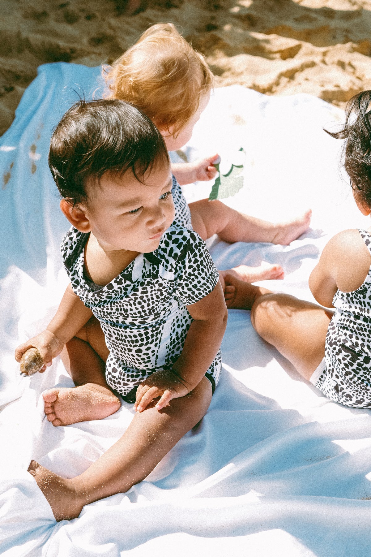 Leopard cone shell onesie