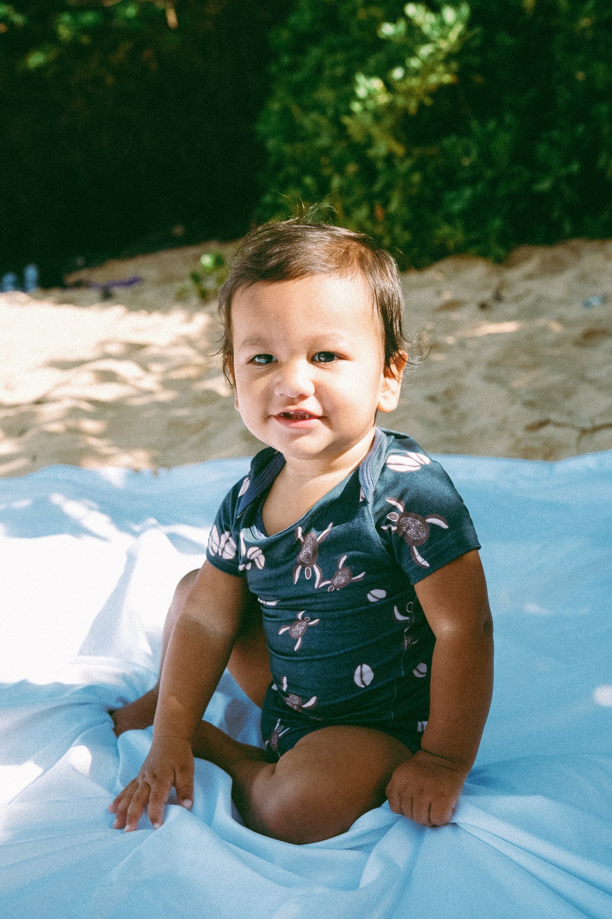 Blue Honu Cowrie onesie