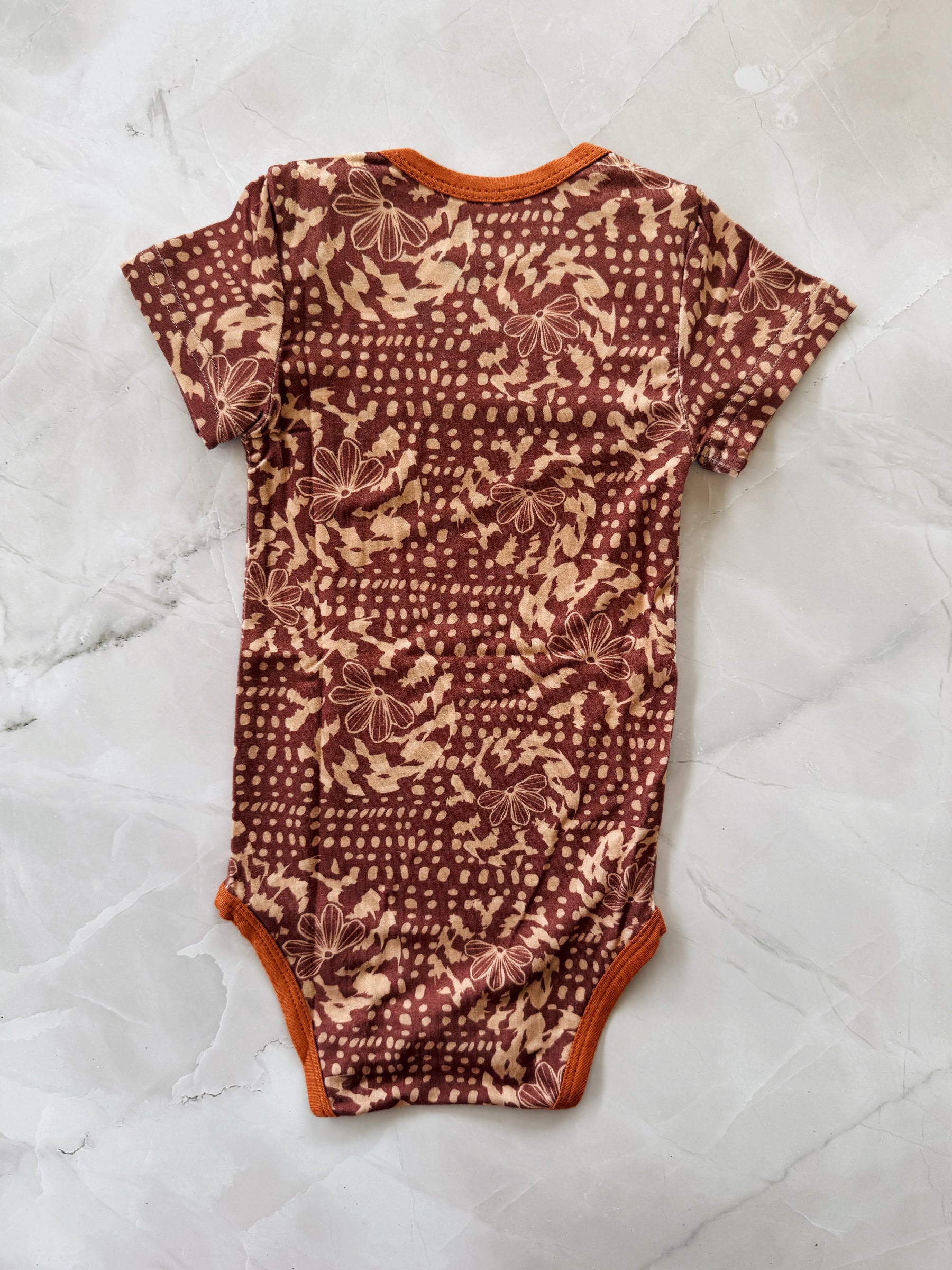 Naupaka shell onesie
