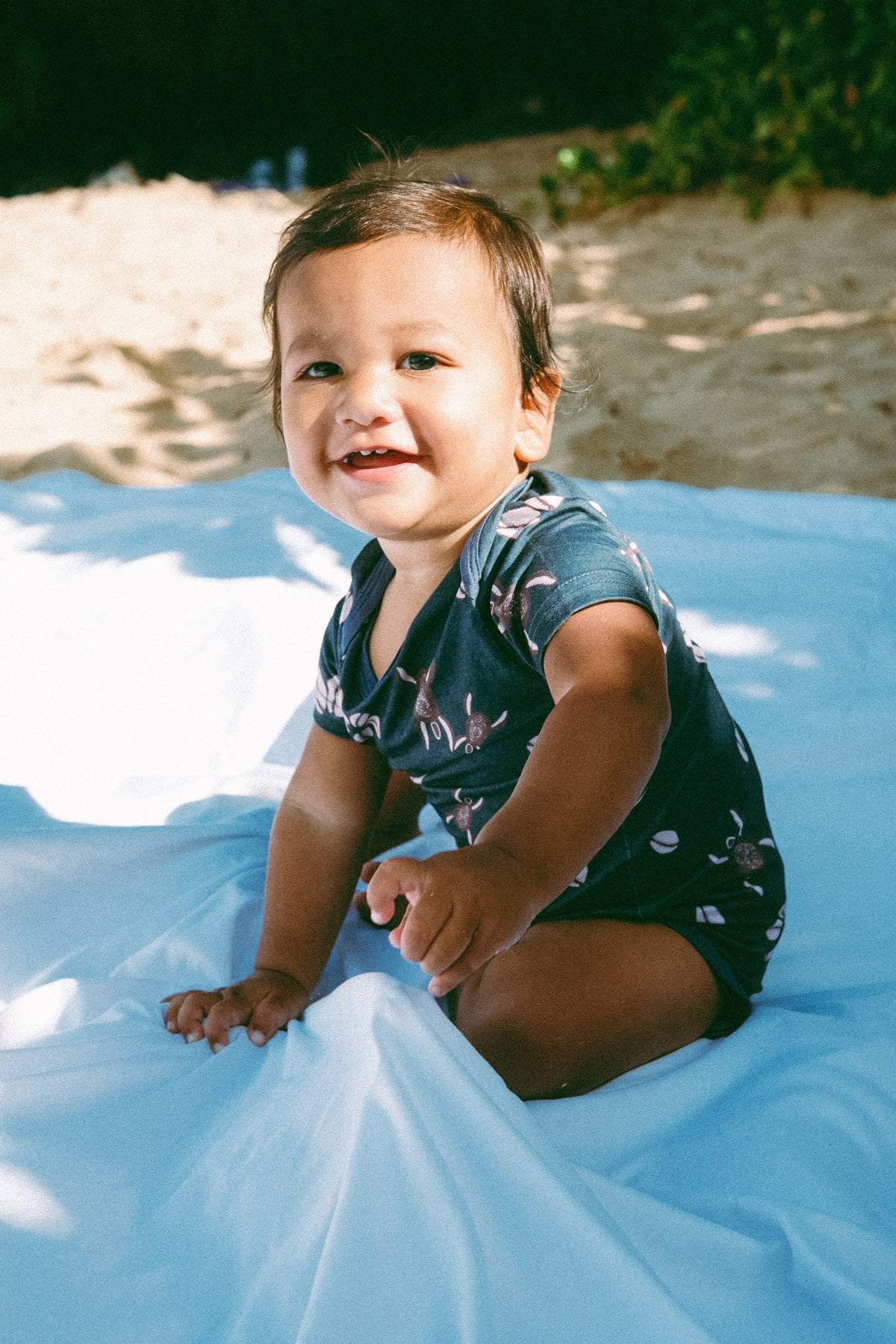 Blue Honu Cowrie onesie
