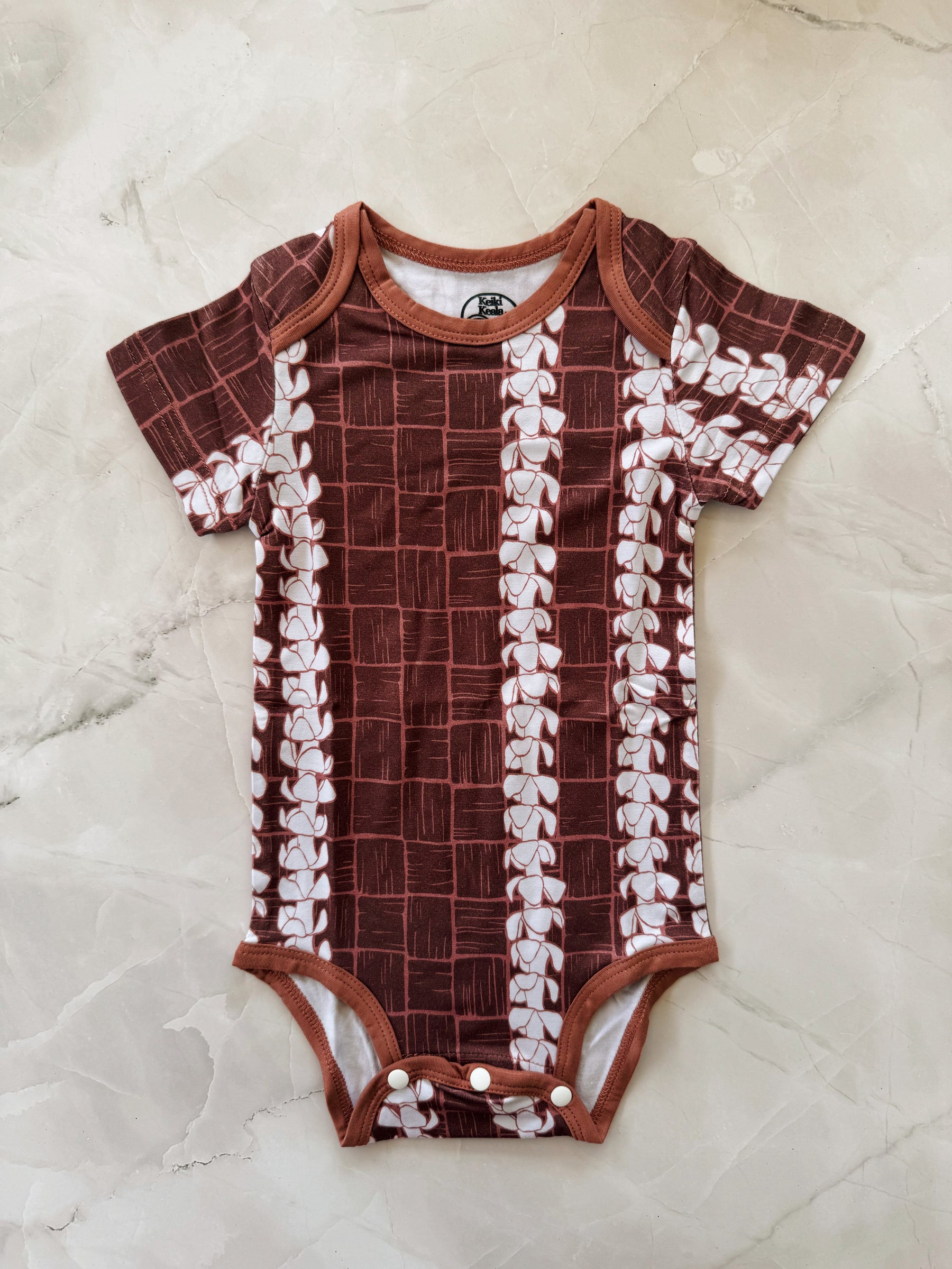 Puakenikeni Lauhala onesie